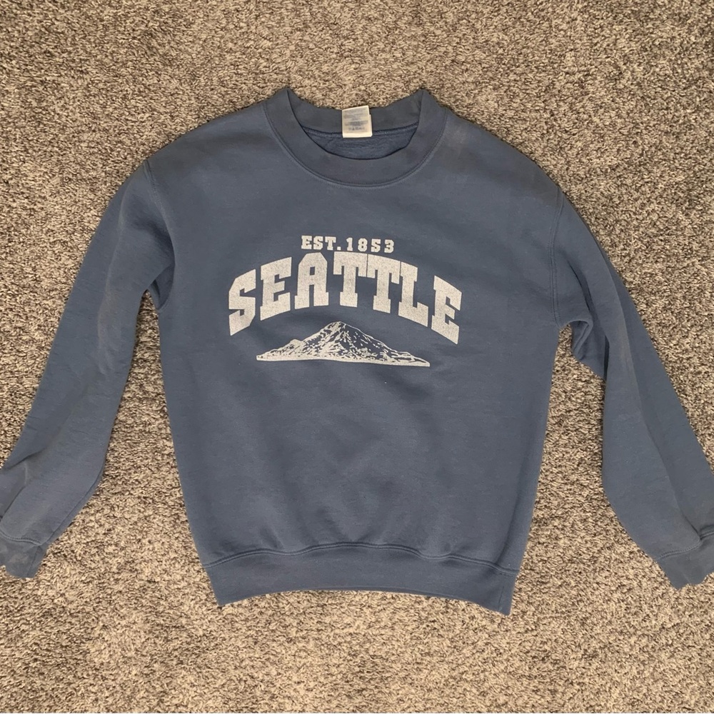 Gildan Blue Seattle Graphic Crewneck Sweater Fits more like a XS.
